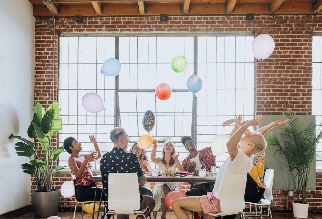 People playing with balloons at a party
